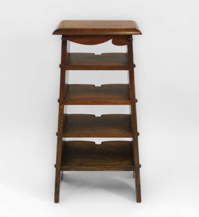 american arts crafts oak paper rack in the style of charles rohlfs 1900s 11