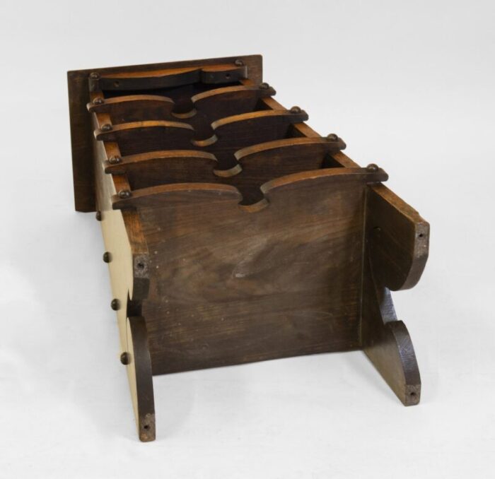 american arts crafts oak paper rack in the style of charles rohlfs 1900s 14