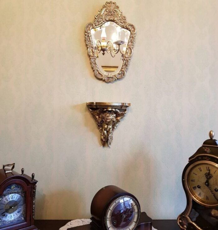 baroque style hollywoods golden era mirror with cherub shelf by dollanzo 3