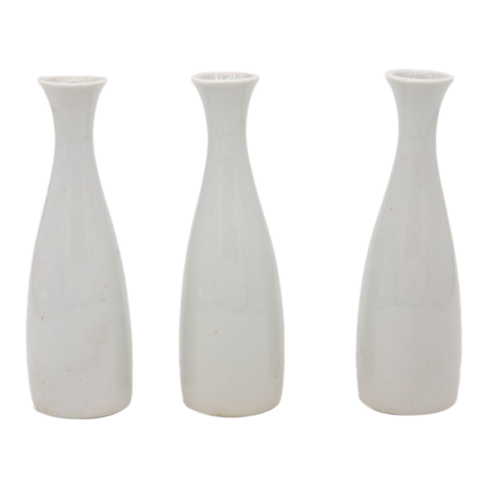 collection of three white single bud vases french early 21st c 8230