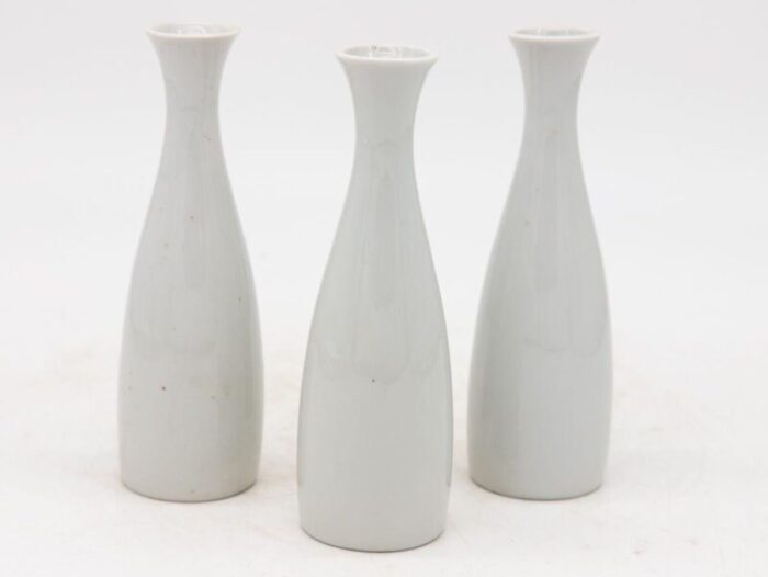 collection of three white single bud vases french early 21st c 8917