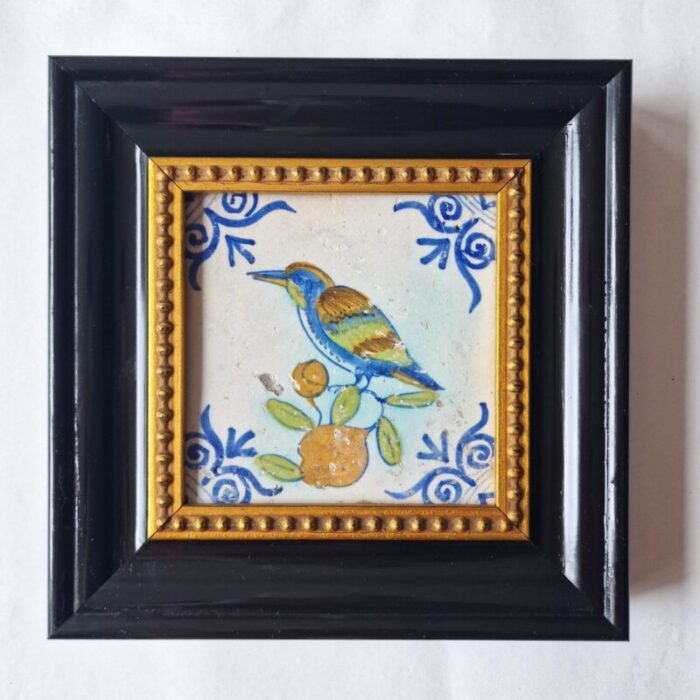 dutch antique framed delft tile with a large kingfisher bird on fruit from pottery harlingen 1640 1