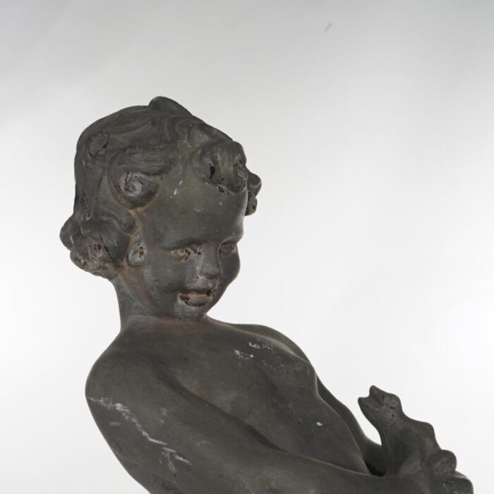 early 20th century antique cast iron figural cherub with frog garden sculpture circa 1900 0806