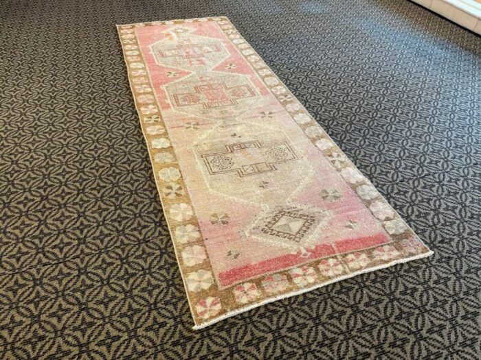 pink distressed corridor runner rug 1980s 3